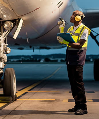 Man checking an airplane